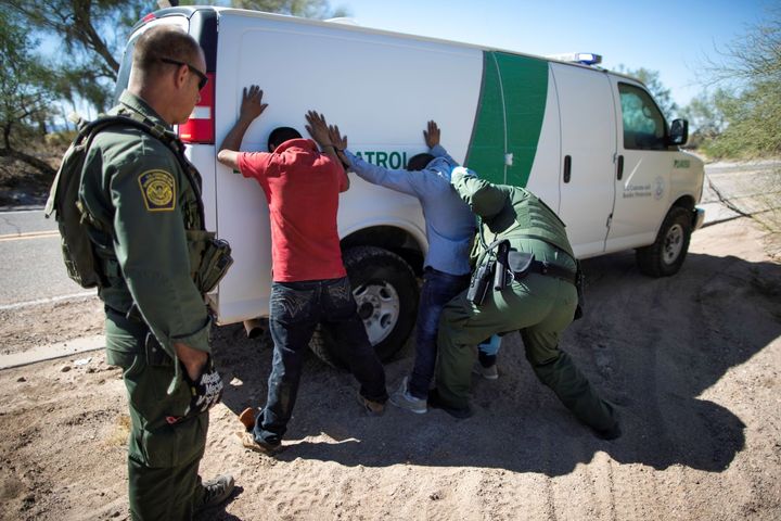 Border Patrol agents arrest migrants who crossed the U.S.-Mexico border in the desert near Ajo, Arizona, U.S., September 11,